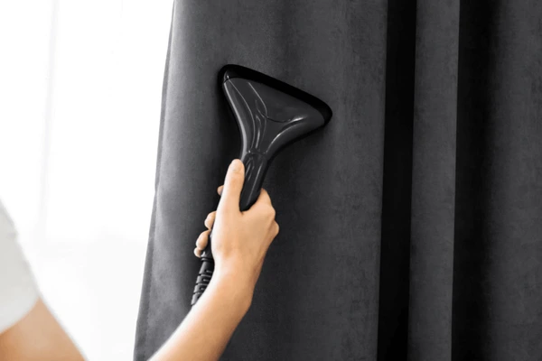 girl-holds-steamer-curtains-her-600nw-1699994965